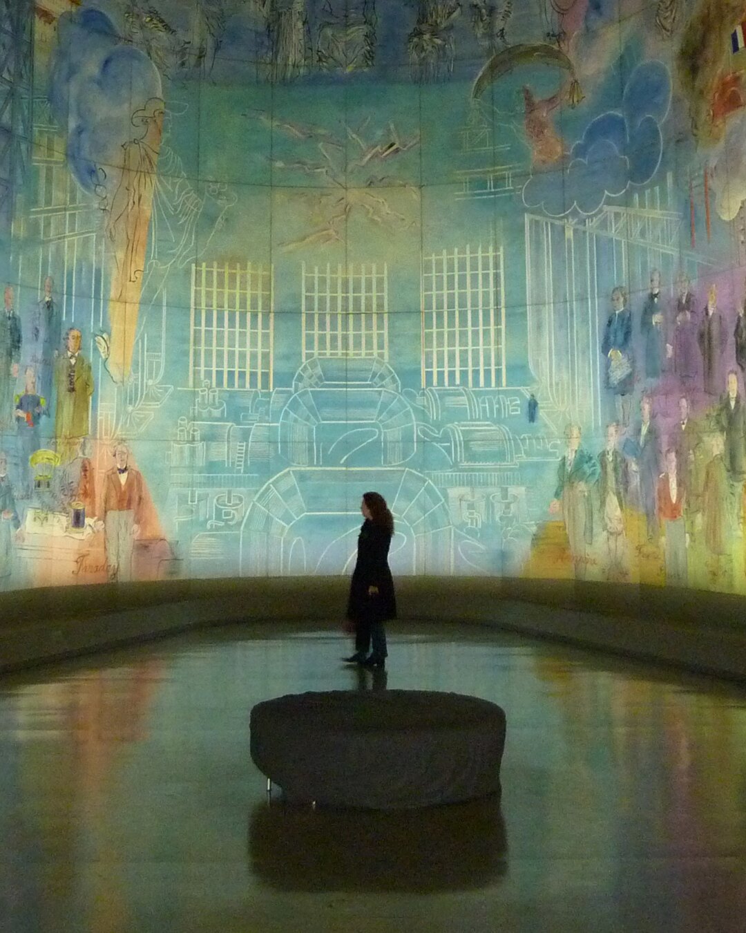 Visitor surrounded by a luminous immersive art installation